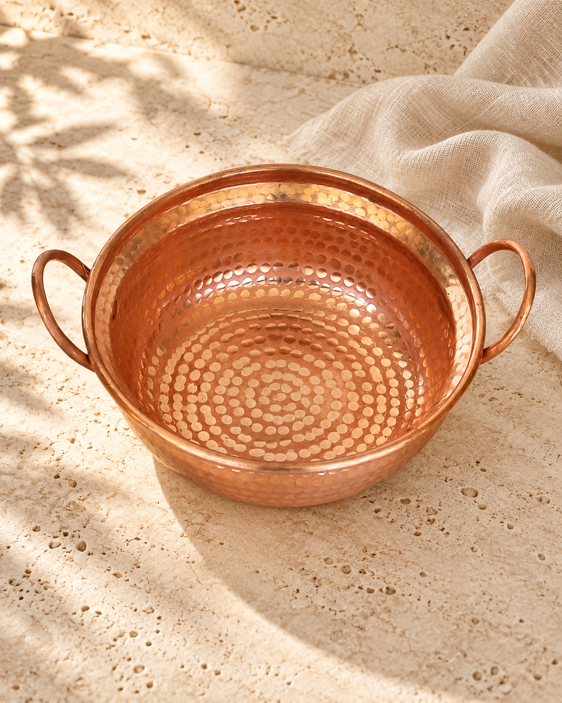copper pot 1 photographed against ivory stone