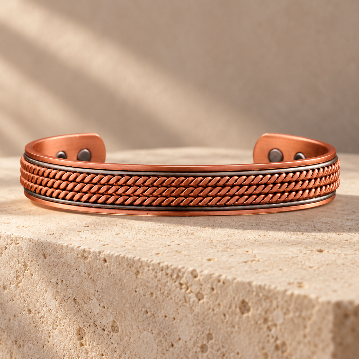 Braided Copper Cuff on limestone