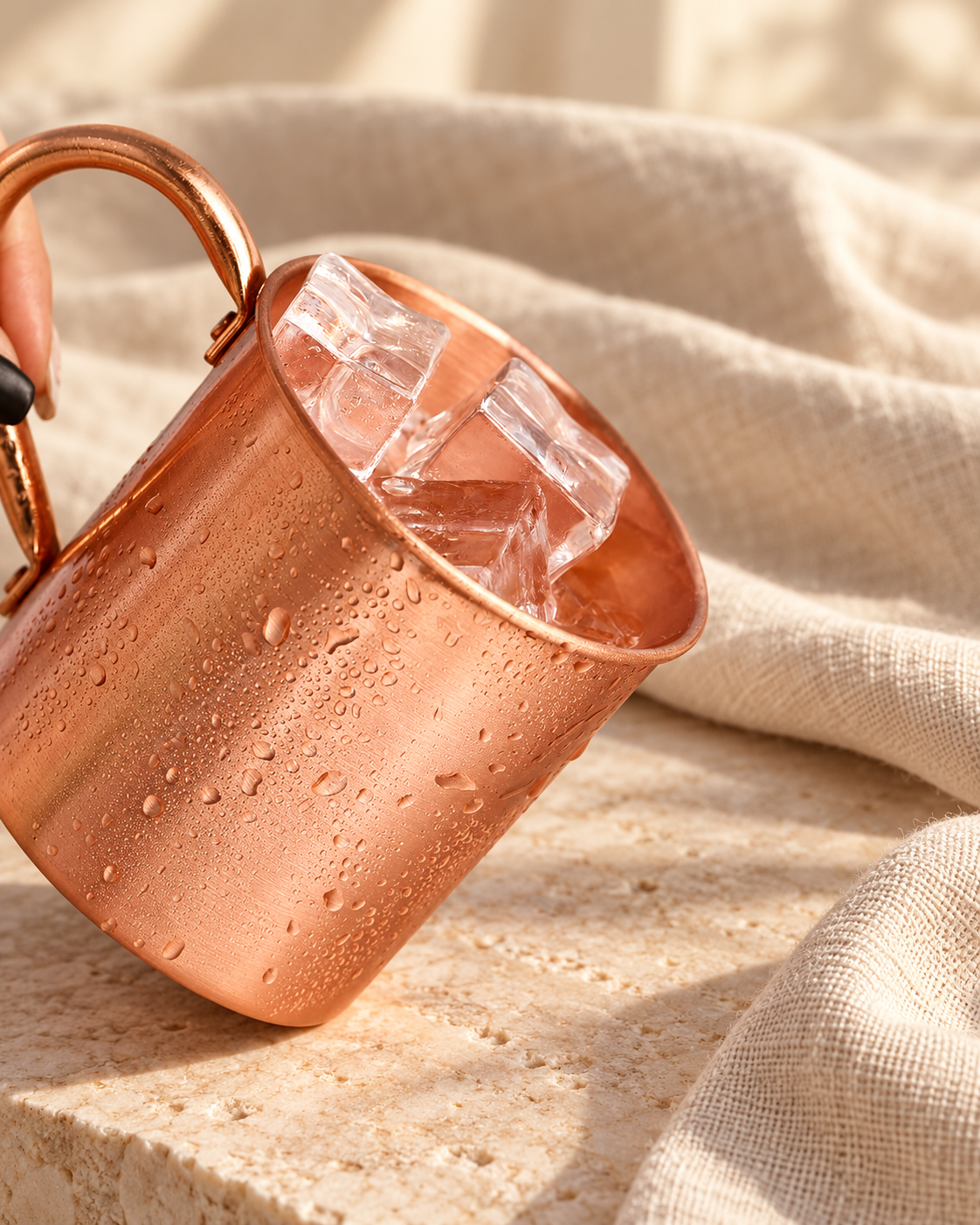 copper wine glass cocktail mug bar cold drink pure copper cup on warm ivory stone