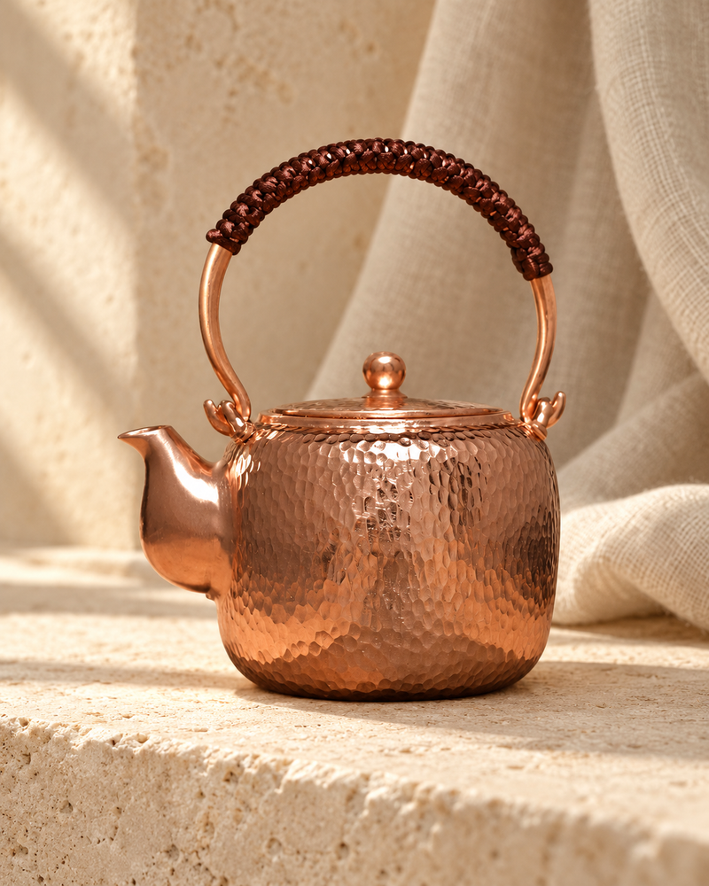 handmade pure purple copper pot in a warm editorial setting