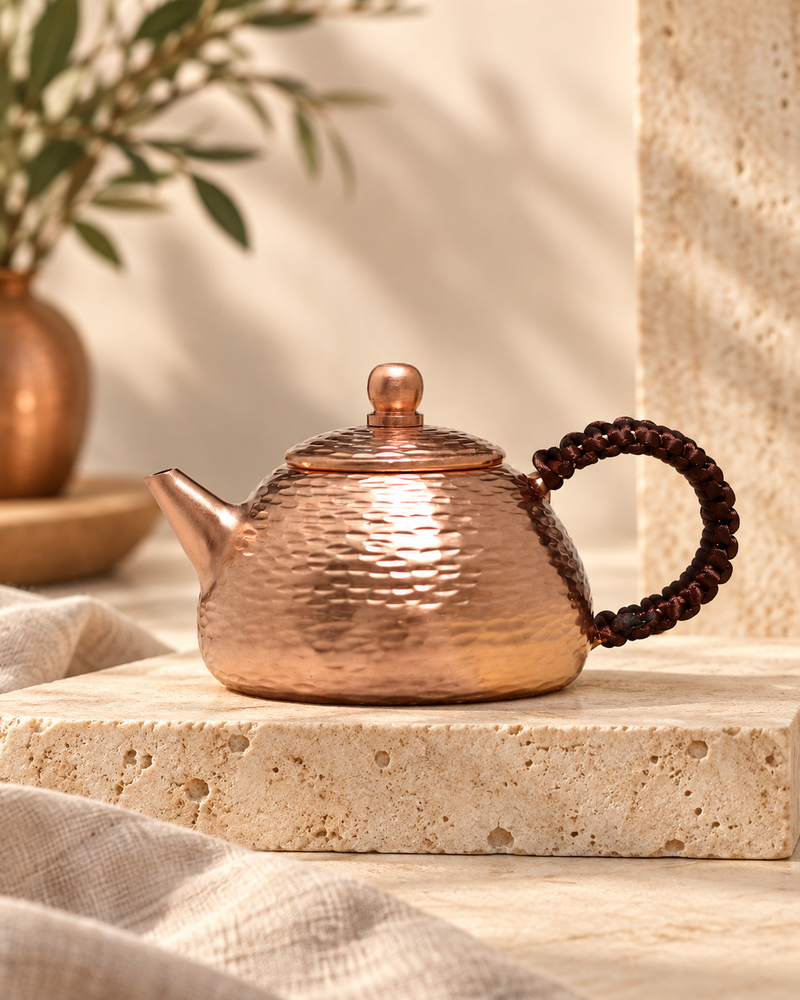 pure red copper handmade copper kettle pure copper kettle in a warm editorial setting